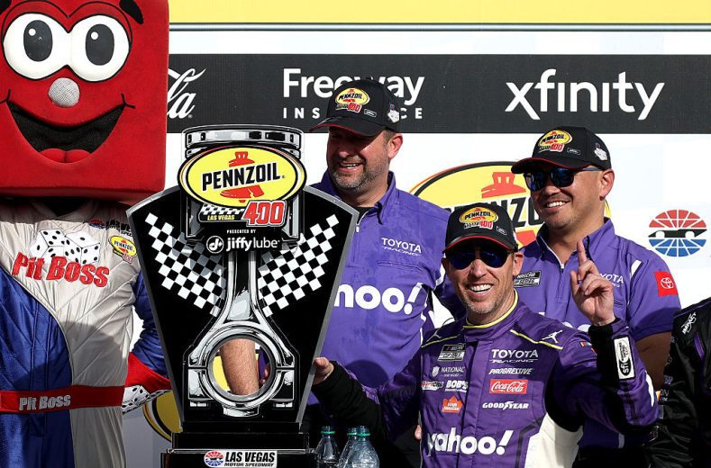 Denny Hamlin celebrates in Victory Lane at Las Vegas Motor Speedway.