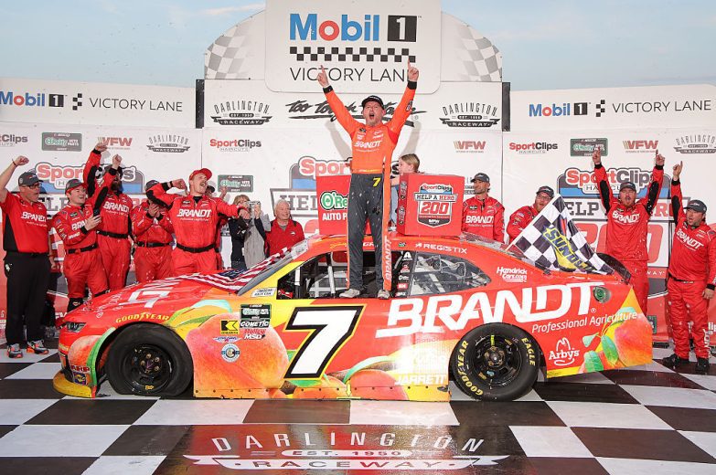 Justin Allgaier celebrates in Victory Lane after his O'Reilly Auto Parts Series win at Darlington Raceway.