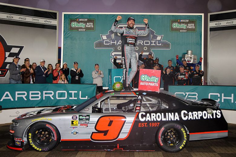 Ross Chastain celebrates in Victory Lane at Charlotte.