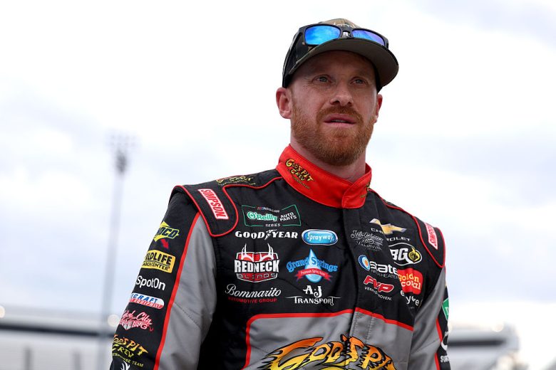 Jeb Burton looks on.