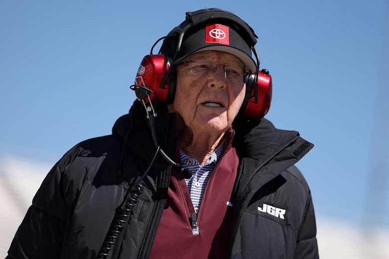Joe Gibbs looks on.
