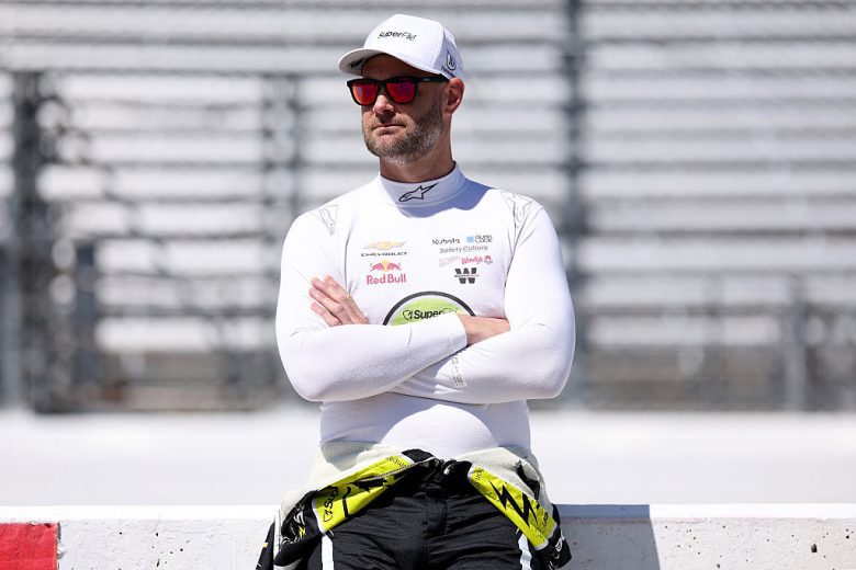 Shane van Gisbergen looks on.