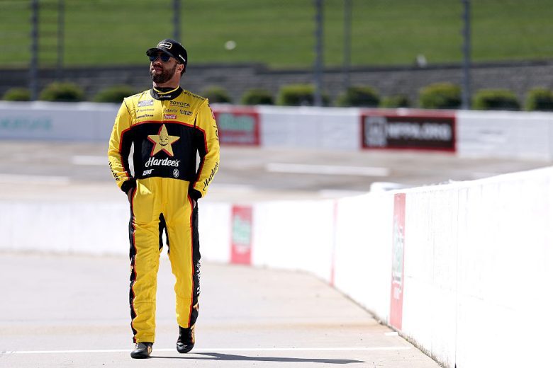 Bubba Wallace looks on.