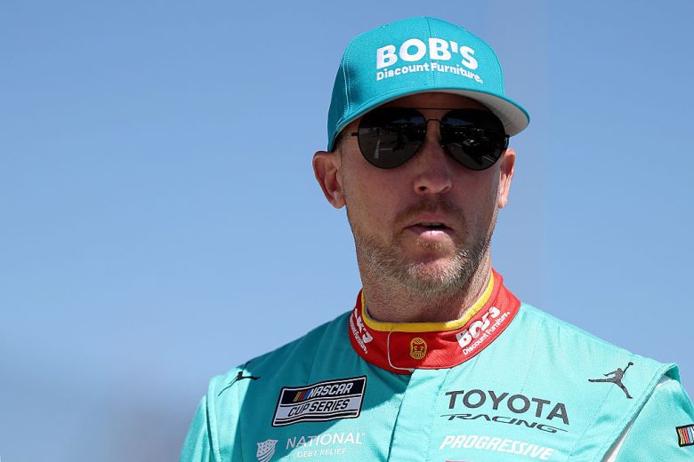 Denny Hamlin looks on.