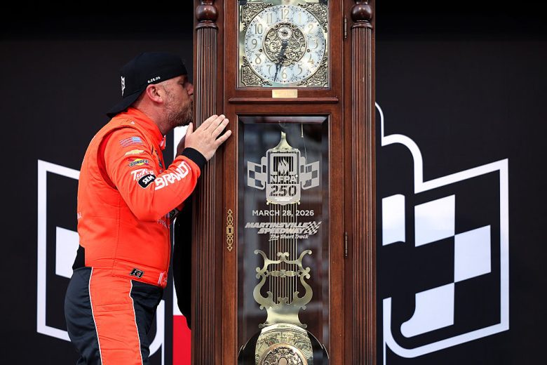 Justin Allgaier kisses the grandfather clock at Martinsville.