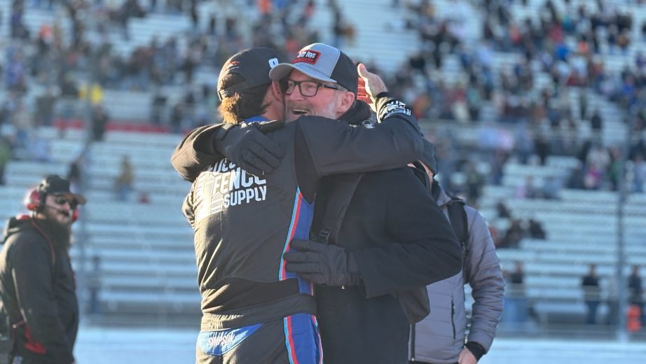 Lee Pulliam and Dale Earmhardt Jr. embrace.