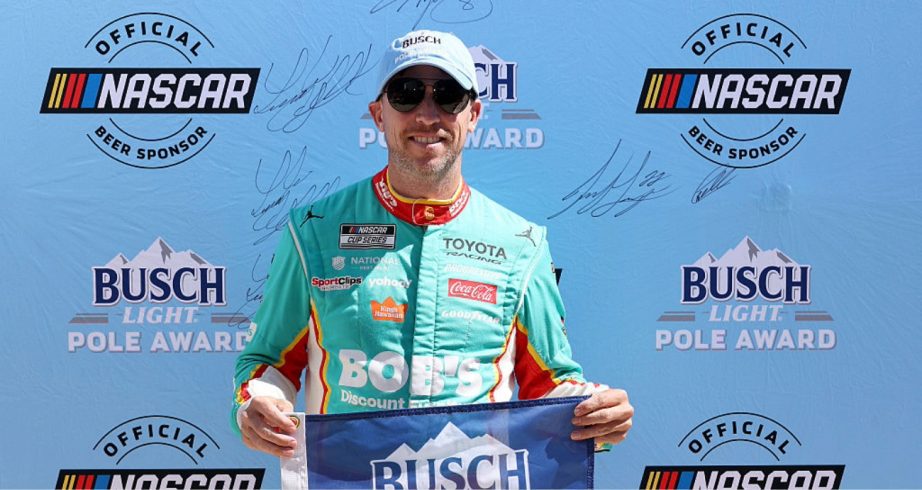 Denny Hamlin celebrates after winning the pole at Martinsville.