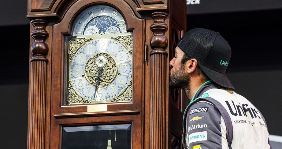 Chase Elliott kisses the Martinsville grandfather clock.