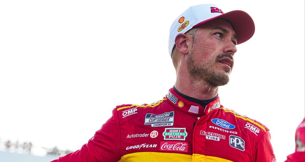 Joey Logano looks on at Martinsville.