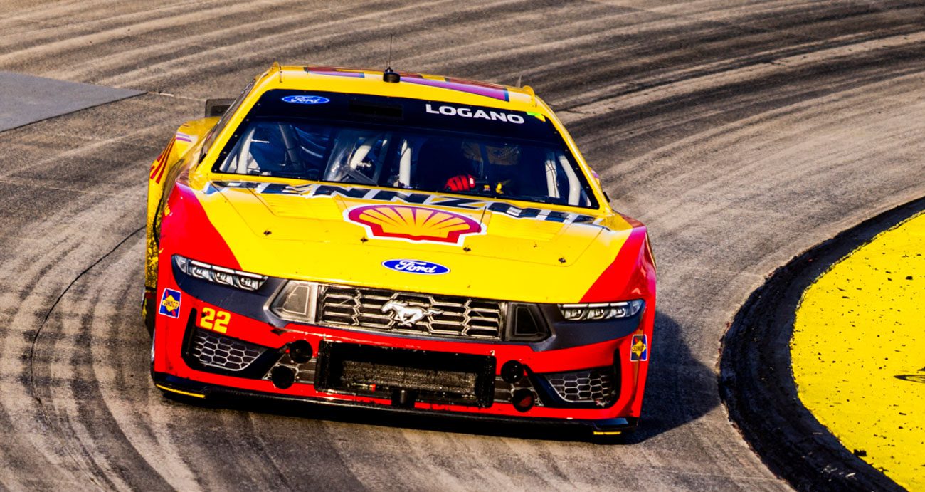 Joey Logano races in the No. 22 Team Penske Ford during a NASCAR Cup Series race at Martinsville Speedway.