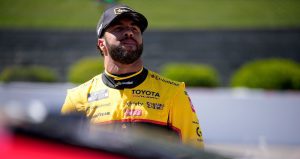 Bubba Wallace looks on.