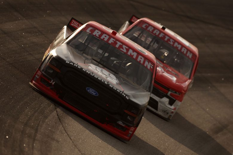 Layne Riggs and Grant Enfinger drive at Rockingham.