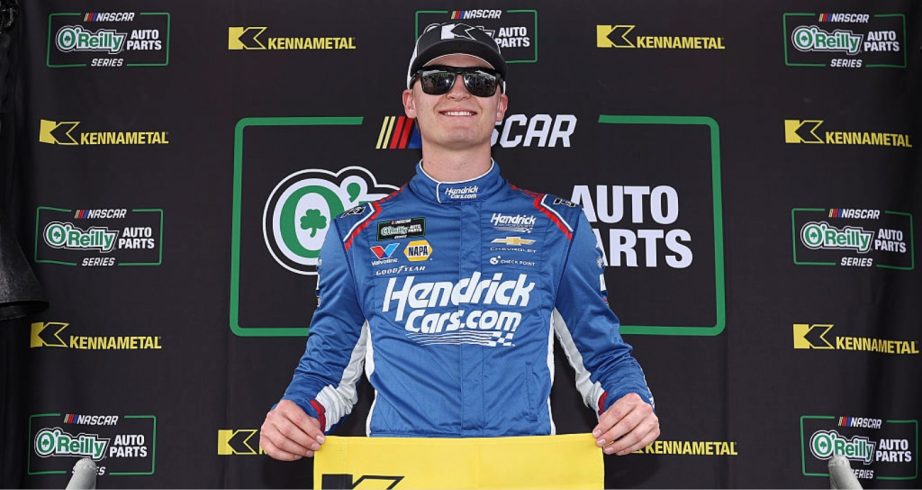 Corey Day celebrates after winning the pole at Rockingham.