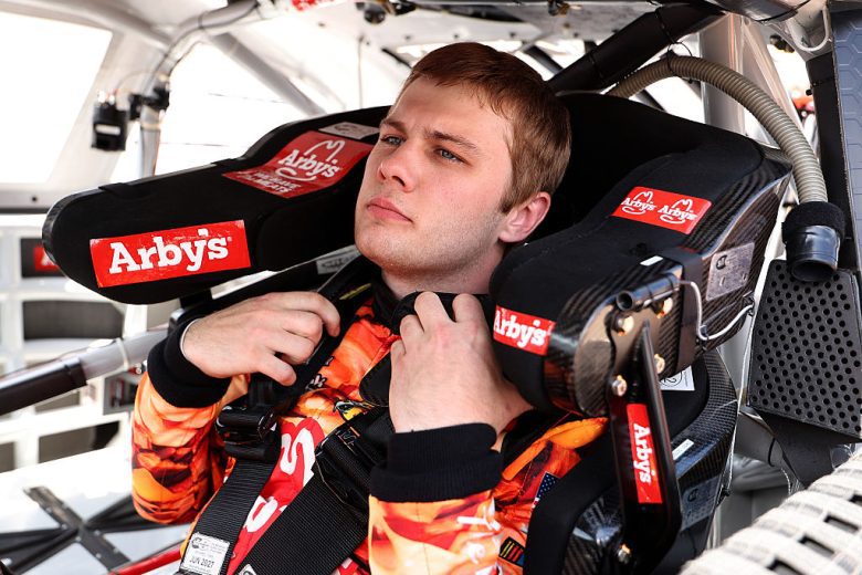 Carson Kvapil sits in his car.