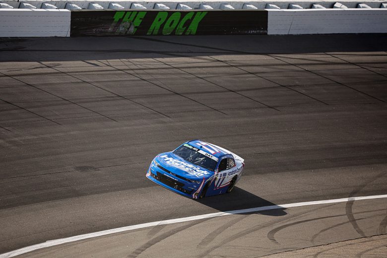 Corey Day drives at Rockingham.