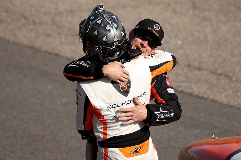 William Sawalich embraces a crew member.