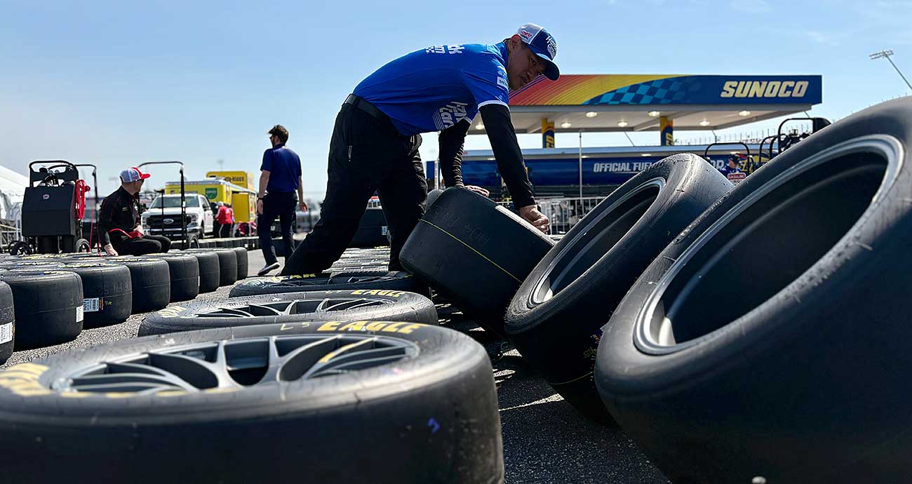 A Hendrick Motorsports crew member prepares Goodyear tires in the Cup Series garage at Darlington Raceway