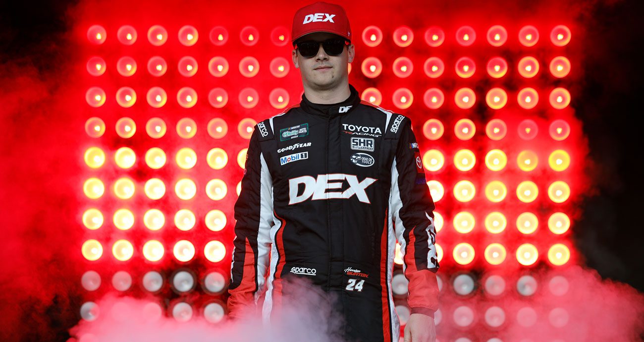 Harrison Burton walks across the stage before a NASCAR O'Reilly Auto Parts Series race at Phoenix Raceway.