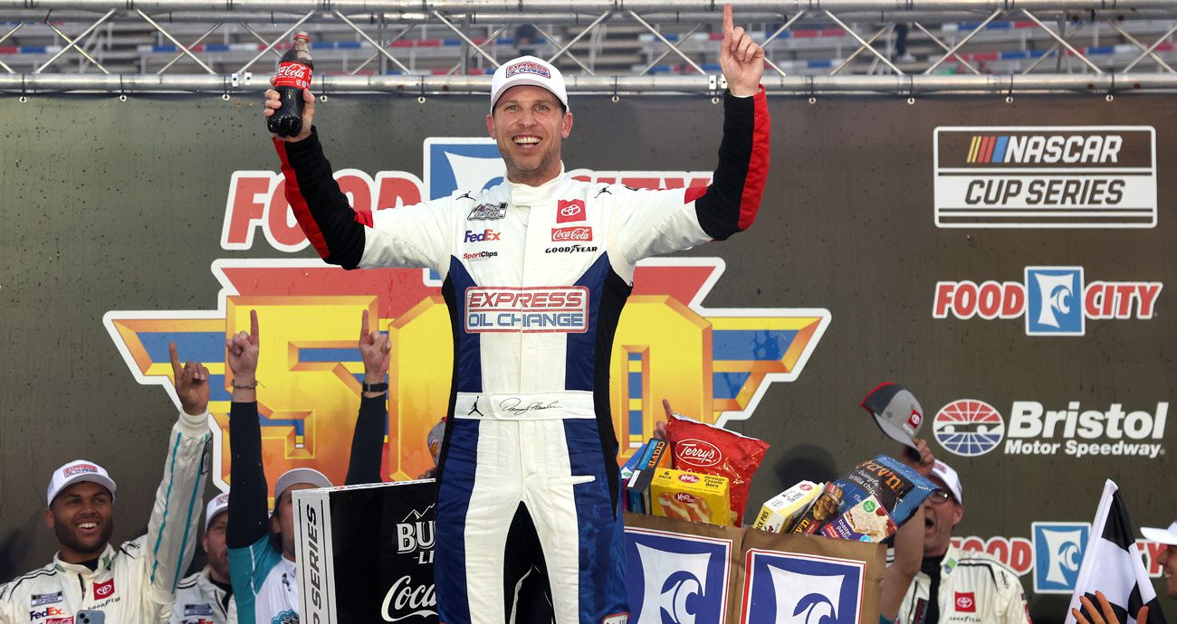 Denny Hamlin celebrates in Victory Lane at Bristol Motor Speedway.