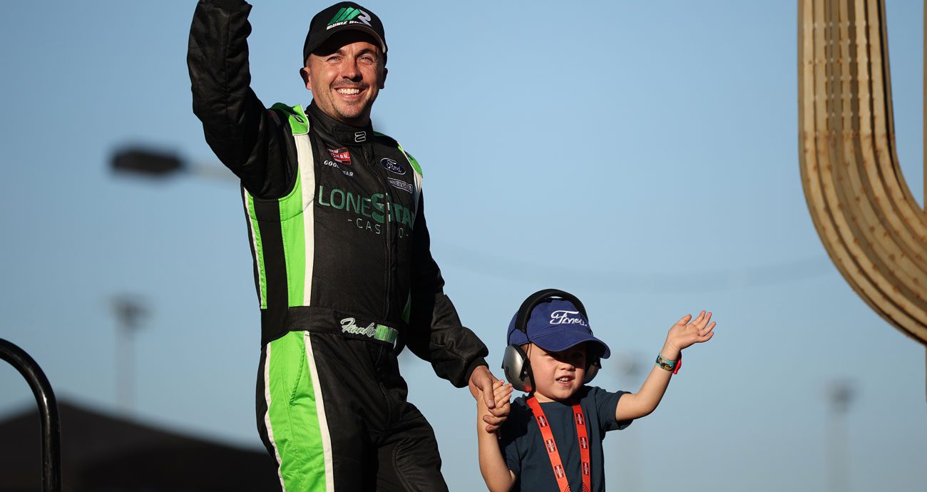 Frankie Muniz and son, Mauz, before a NASCAR Craftsman Truck Series race.