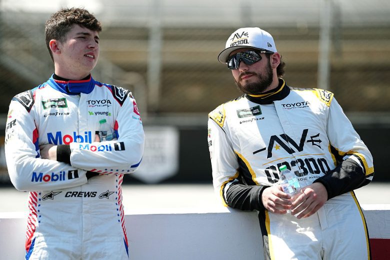 Brent Crews and Taylor Gray look on.