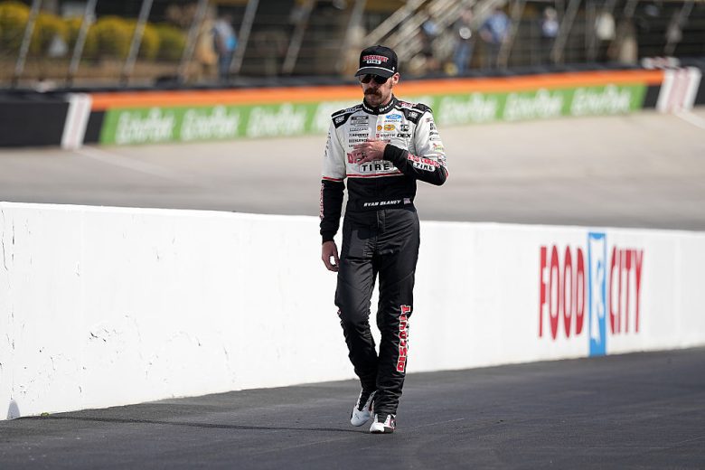 Ryan Blaney walks down pit road.