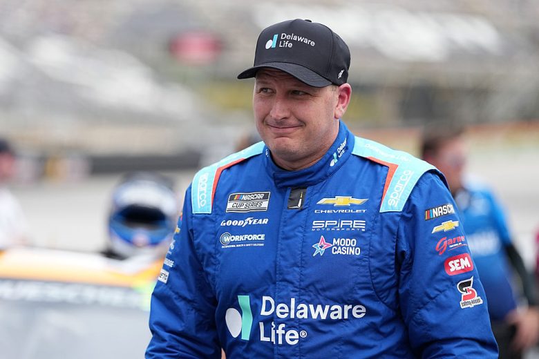 Michael McDowell looks on.