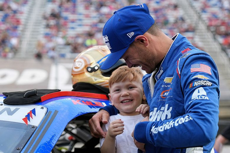 Kyle Larson and Cooper Larson look on.