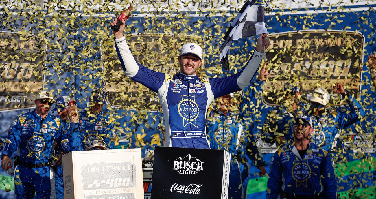 Chase Elliott celebrates in Victory Lane at Kansas Speedway.