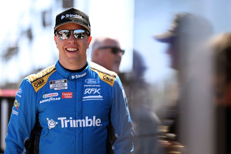 Brad Keselowski look on.