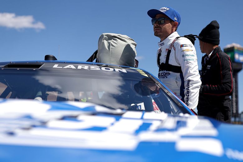Kyle Larson enters his car at Kansas.