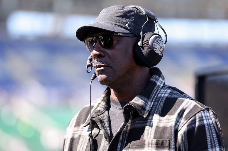 Michael Jordan looks on.