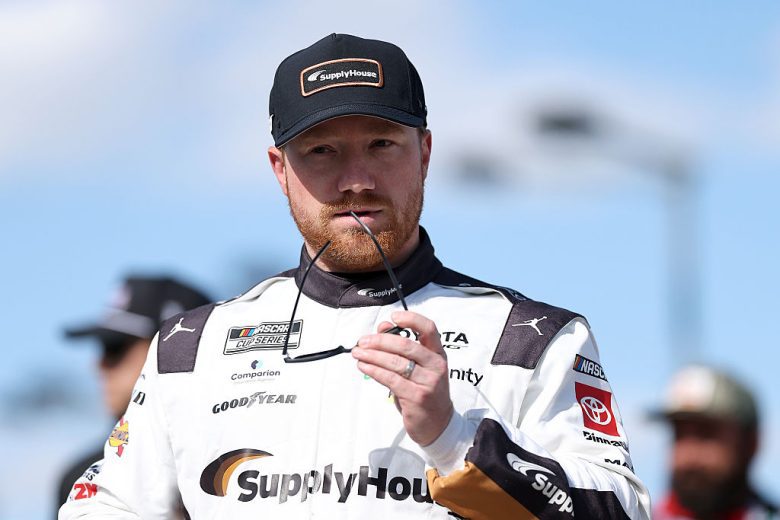 Tyler Reddick looks on.