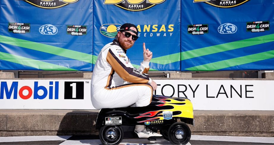 Tyler Reddick celebrates after winning the pole at Kansas.