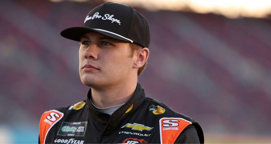 Carson Kvapil looks on.