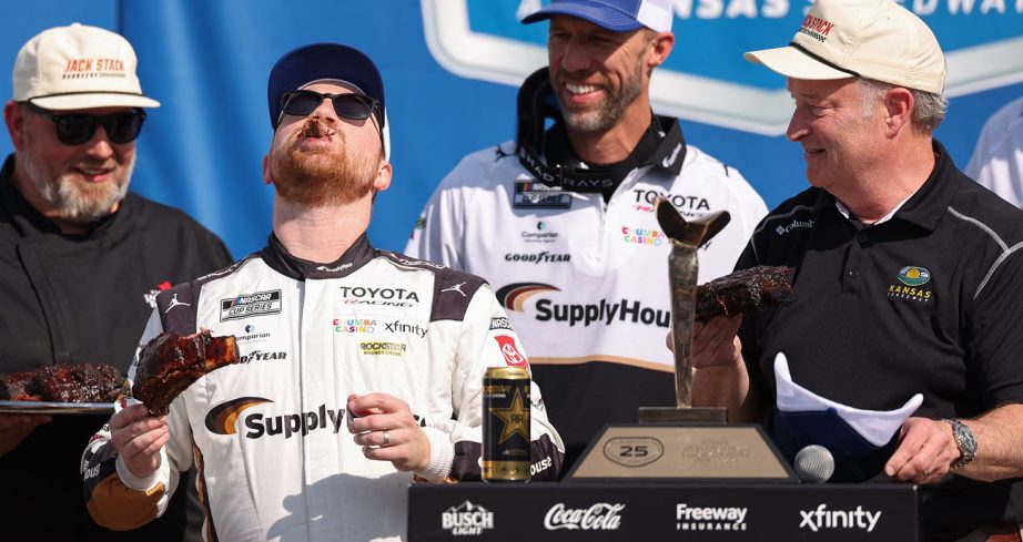 Tyler Reddick celebrates in Victory Lane at Kansas Speedway.