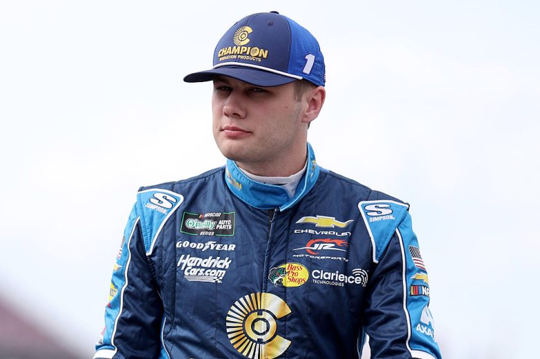 Carson Kvapil looks on.