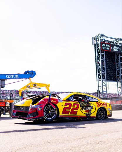The No. 22 Ford gets towed following a NASCAR Cup Series wreck at Talladega Superspeedway.