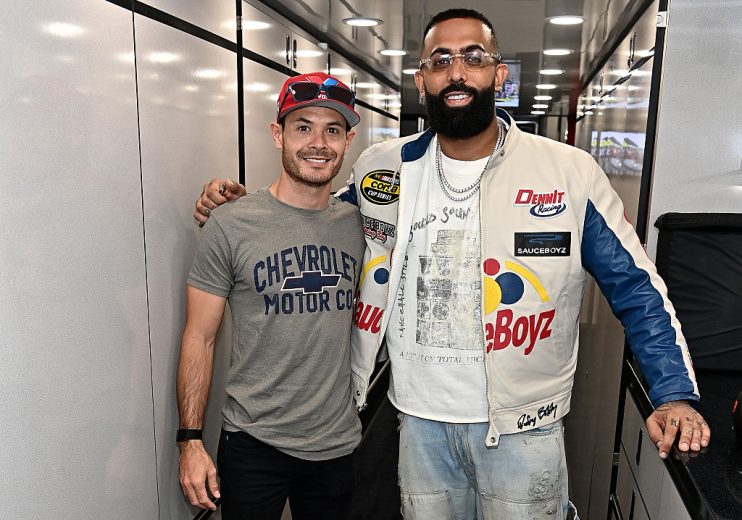 Kyle Larson (L) and Eladio Carrion (R) pose for a photo.