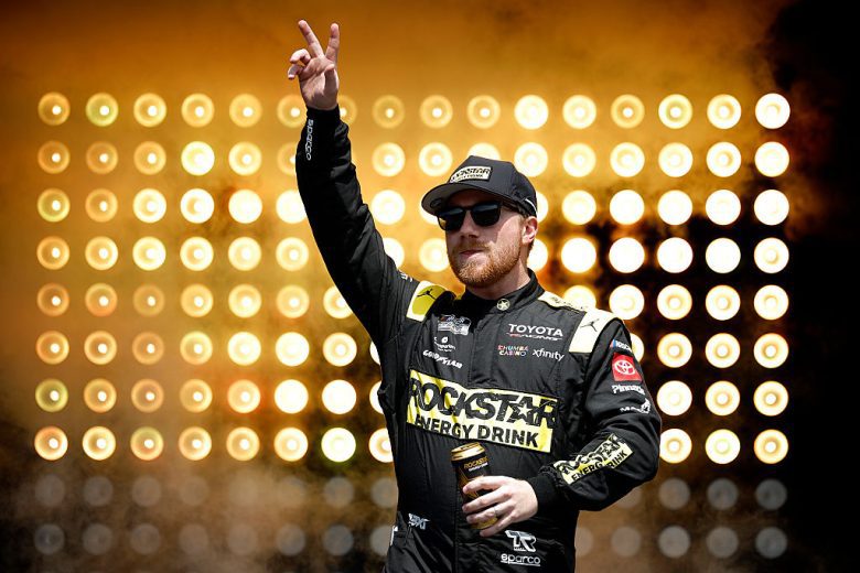 Tyler Reddick waves to the crowd at Talladega Superspeedway.