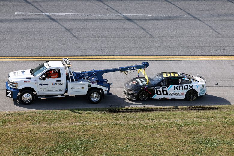 The No. 66 Ford gets towed following a NASCAR Cup Series wreck at Talladega Superspeedway.