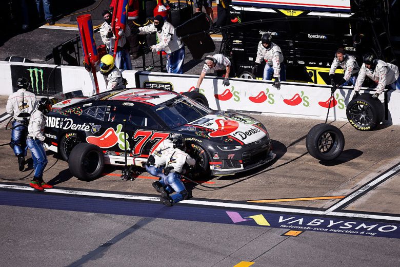 Carson Hocevar's No. 77 Chevrolet gets tended to on pit road.
