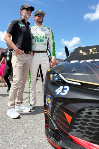Jimmie Johnson (L) and Erik Jones (R) pose for a photo.