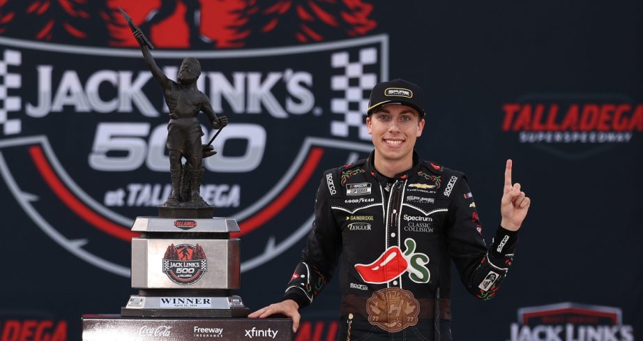 Carson Hocevar poses with the trophy in Victory Lane.