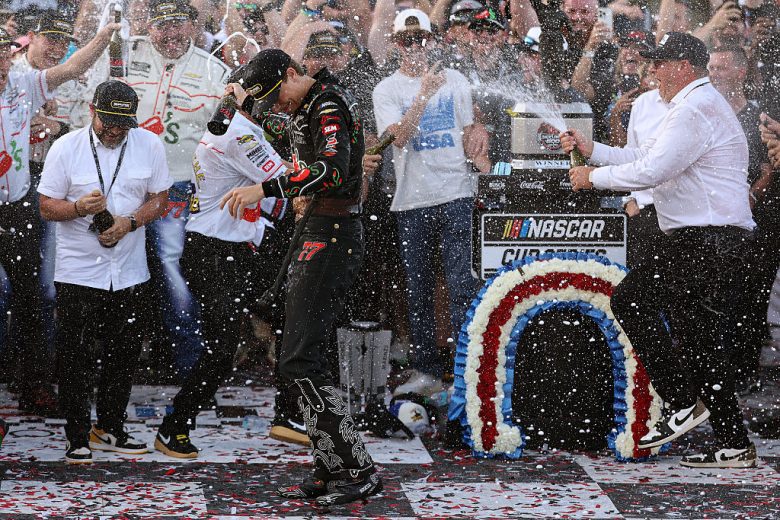 Carson Hocevar celebrates with his team in Victory Lane at Talladega Superspeedway.