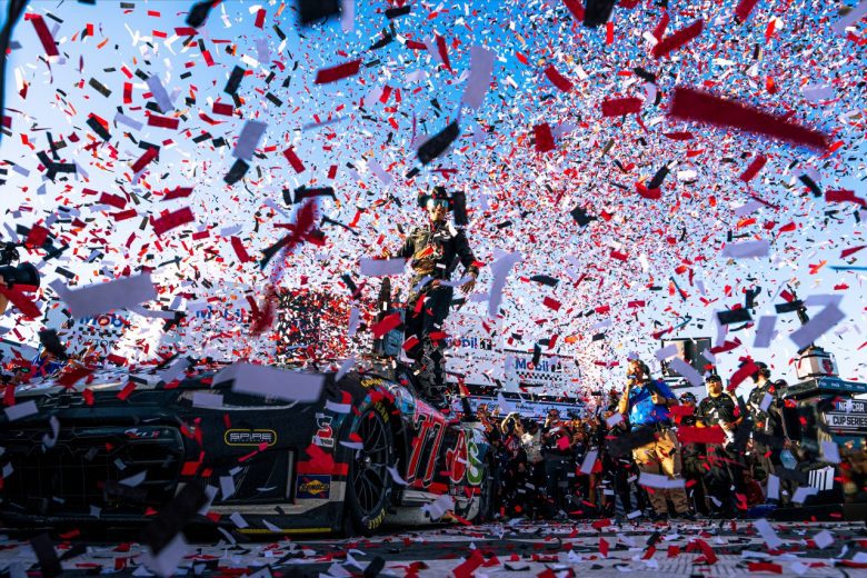 Carson Hocevar celebrates in Victory Lane as confetti falls at Talladega Superspeedway.