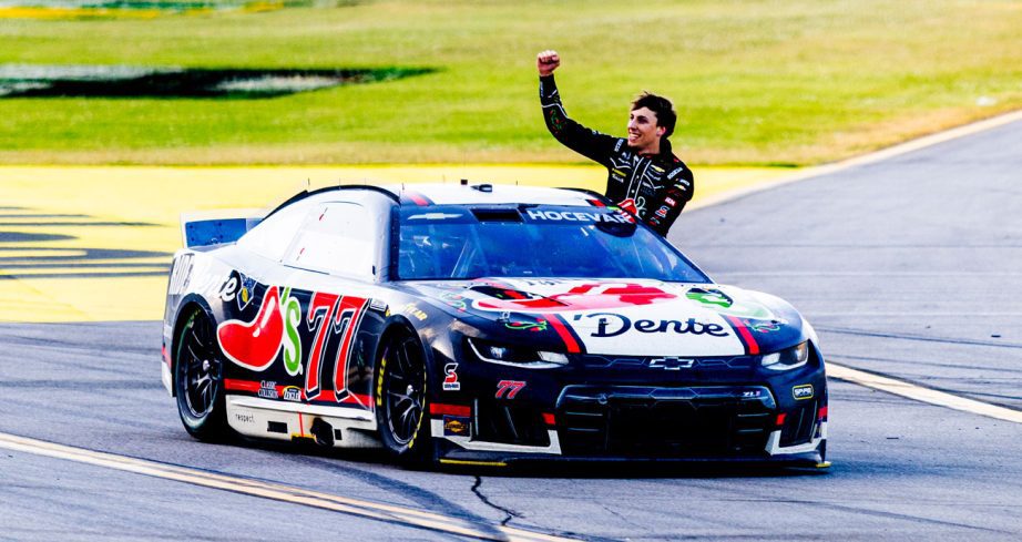Carson Hocevar celebrates in the No. 77 Chili's Chevy at Talladega.