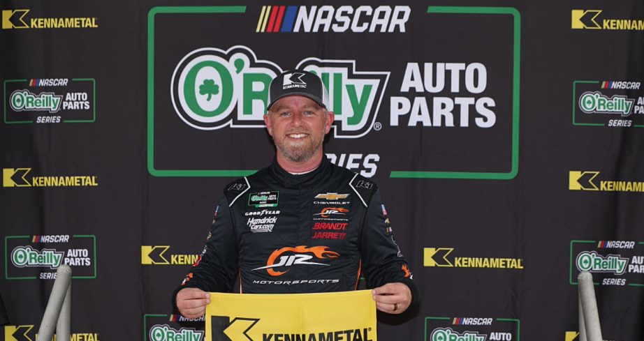 Justin Allgaier celebrates after winning the pole at Texas.