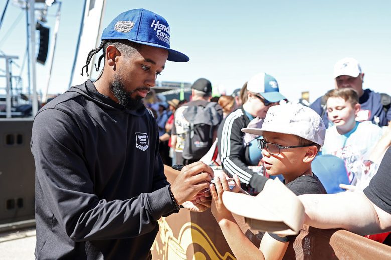 Rajah Caruth signs autographs.