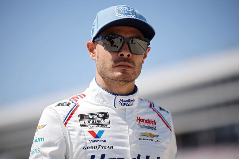 Kyle Larson looks on.